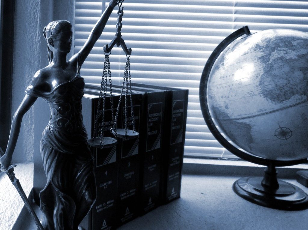 books and justice statue