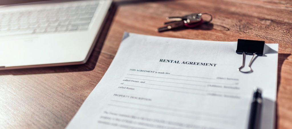 rental agreement contract on table