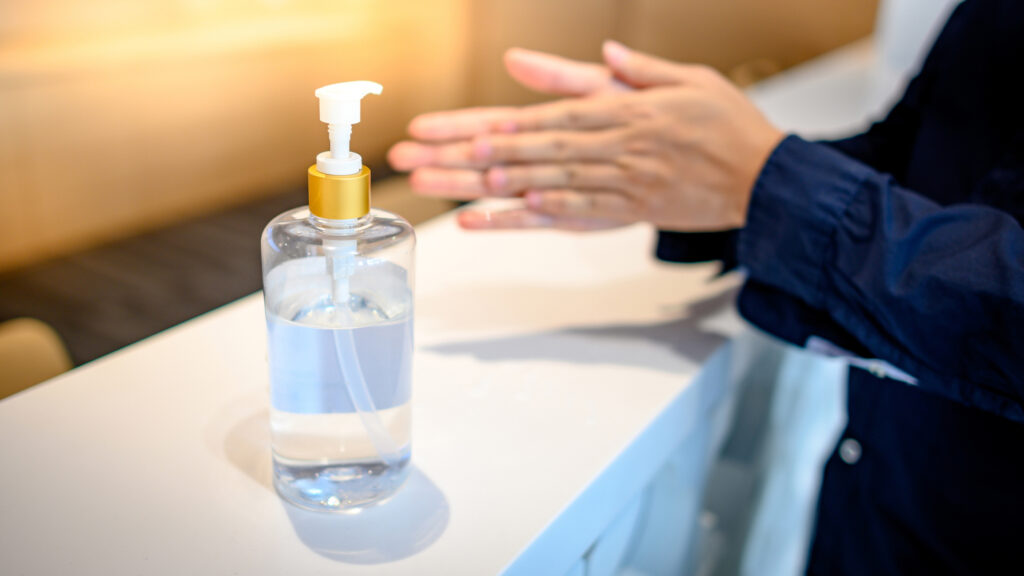 cleaning hands with sanitizer