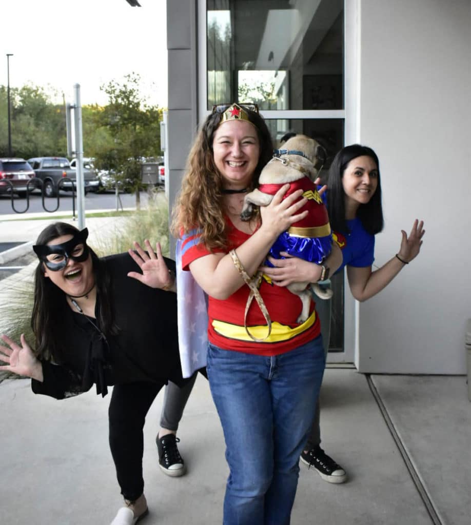 Kari Guerrero, Legal Assistant at Rosenblatt Law Firm having fun with coworkers in Halloween. Dressed wonder Women